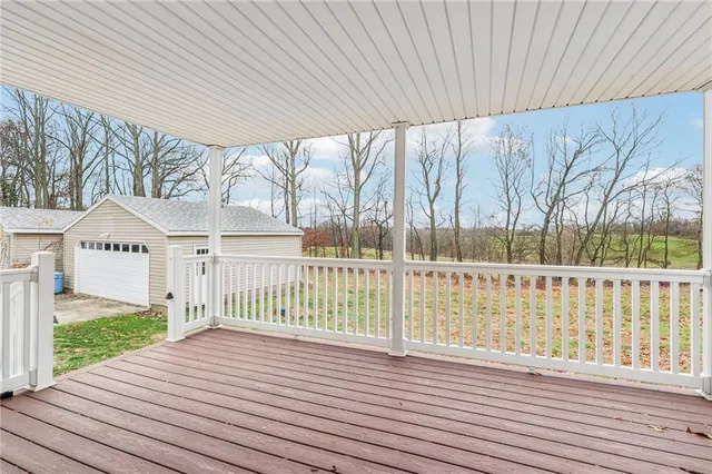 a backyard of a house with a large tree