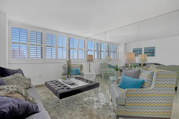 a living room with furniture and a table