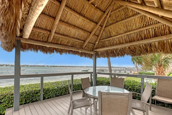 a patio with a yard table and chairs