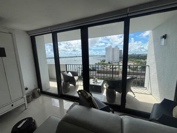 a living room with furniture and a window