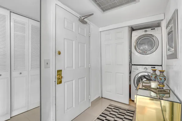 a view of a storage & utility room with a washer dryer