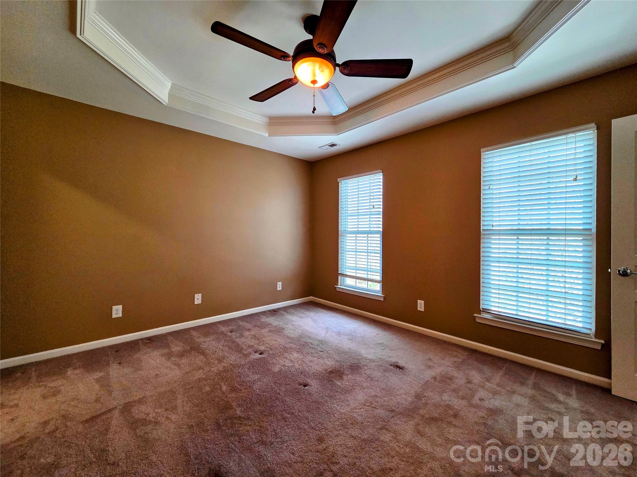 1114 Drayton Court Fort Mill, SC 29708 - Photo 14 of 31 a view of an empty room with window and chandelier fan