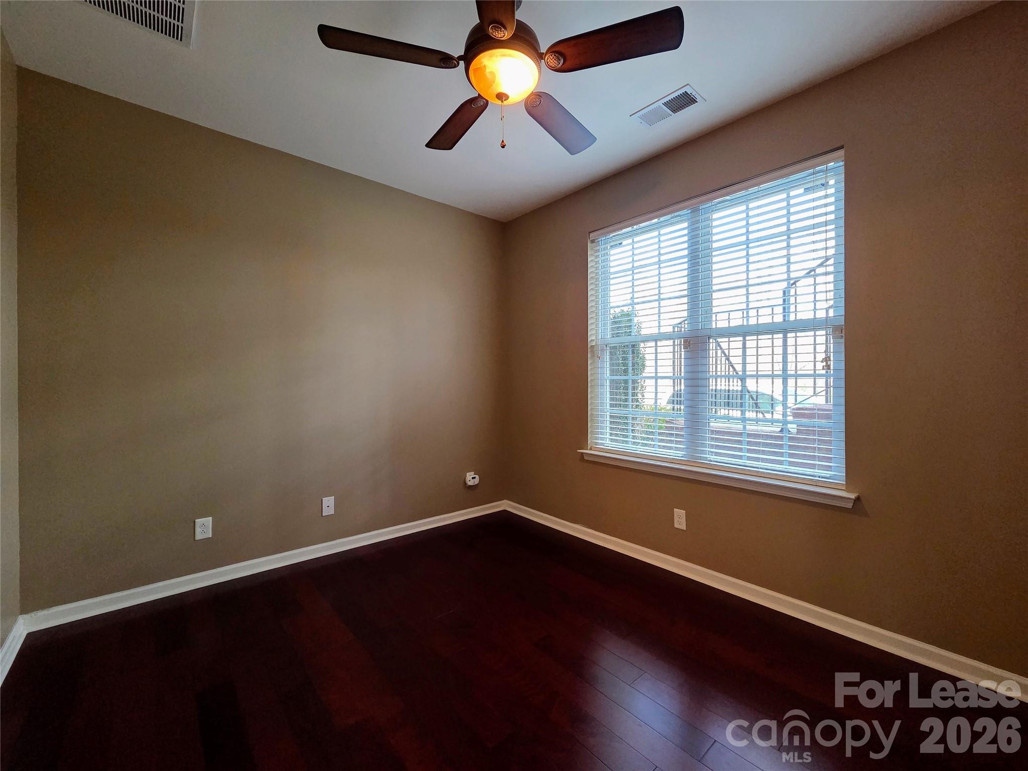 1114 Drayton Court Fort Mill, SC 29708 - Photo 20 of 31 an empty room with wooden floor and windows