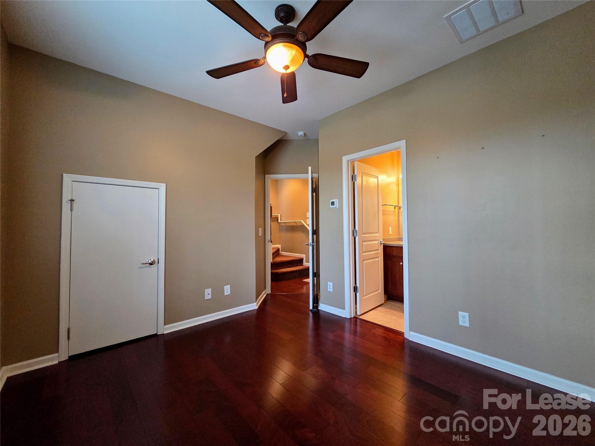 1114 Drayton Court Fort Mill, SC 29708 - Photo 21 of 31 a view of an empty room with window and wooden floor
