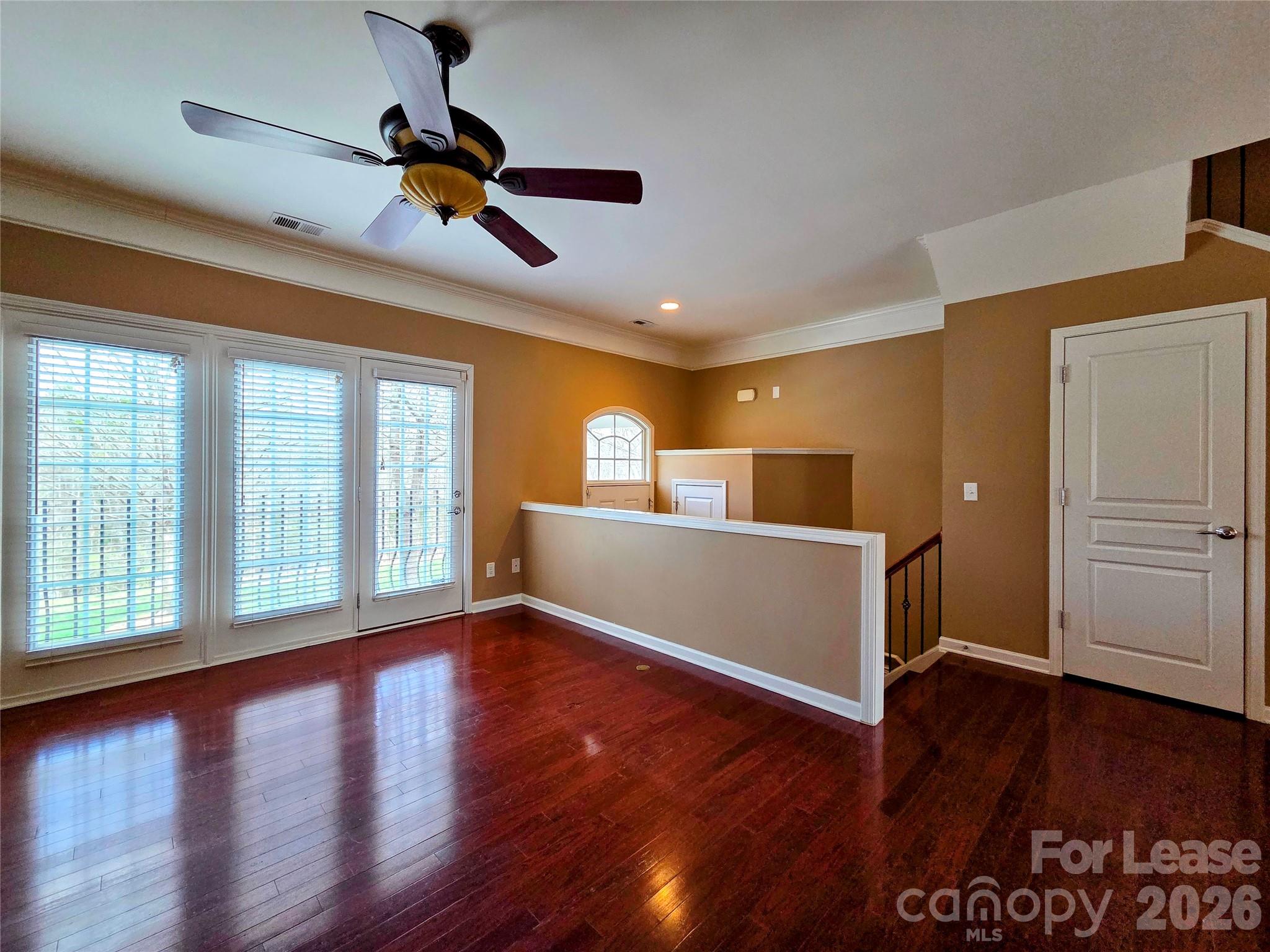 1114 Drayton Court Fort Mill, SC 29708 - Photo 4 of 31 a view of empty room with wooden floor and fan
