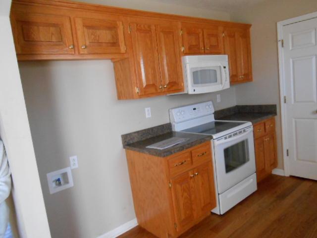 MORE PRETTY CABINETS. UTILITY ROOM COMES OFF KITCHEN