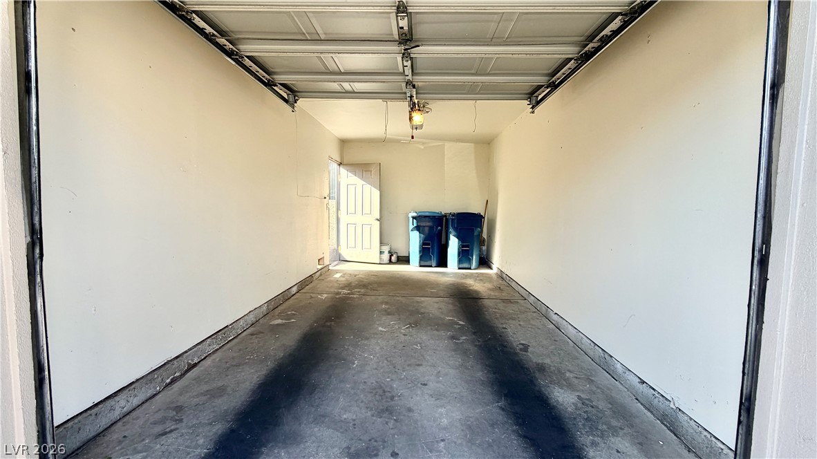 6250 West Flamingo Road, Unit 4 Las Vegas, NV 89103 - Photo 40 of 45 This spacious garage offers convenient vehicle storage and direct access to the interior.