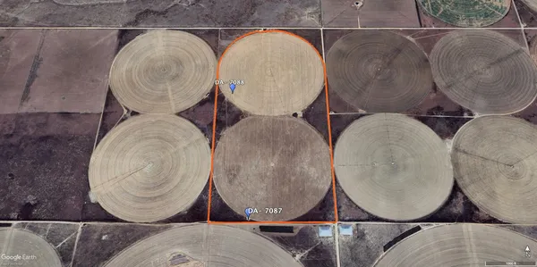 a close view of water heater room with wooden cabinets