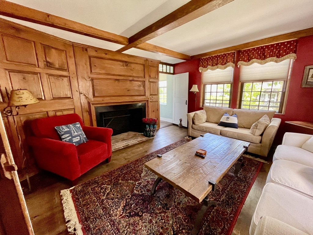 4 Traders Lane Nantucket, MA 02554 - Photo 5 of 15 a living room with furniture rug and a fireplace