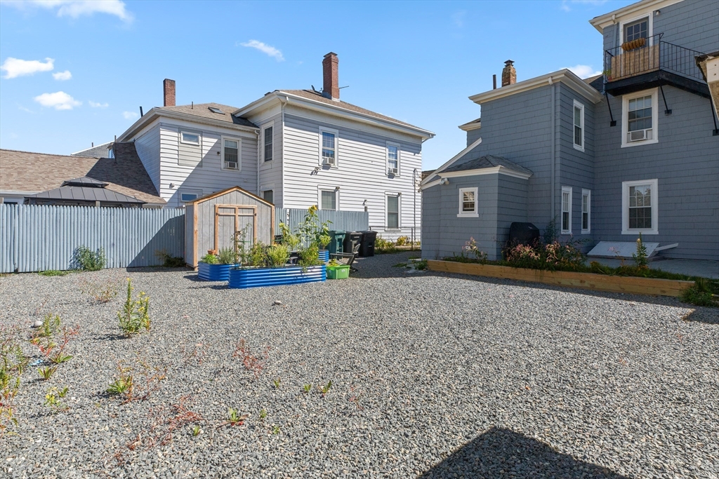 40 Middle Street, Unit 2 Gloucester, MA 01930 - Photo 15 of 21 a front view of a house with a yard