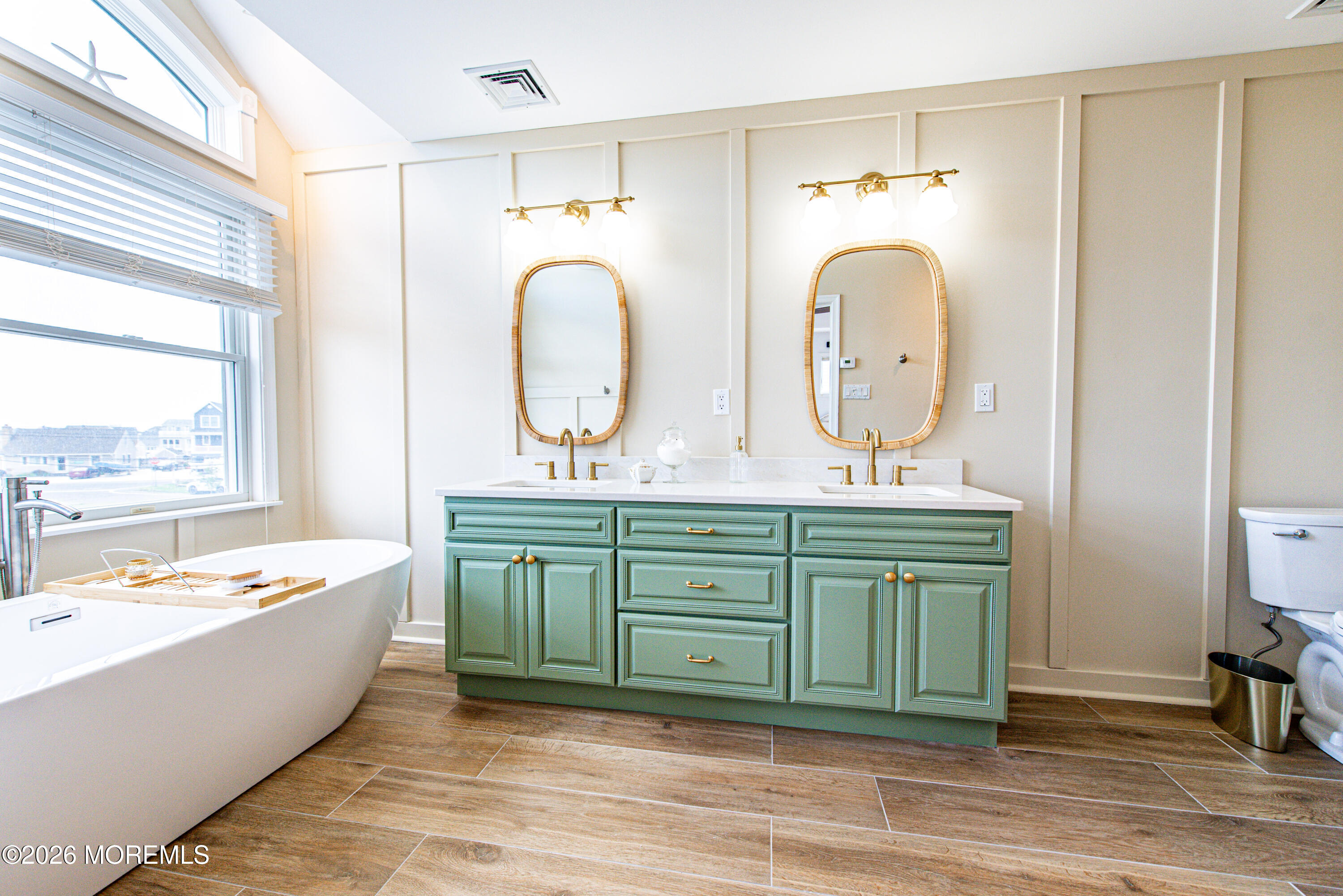 5 A Sunset Boulevard Barnegat Light, NJ 08006 - Photo 22 of 65 a bathroom with a tub sink and mirror