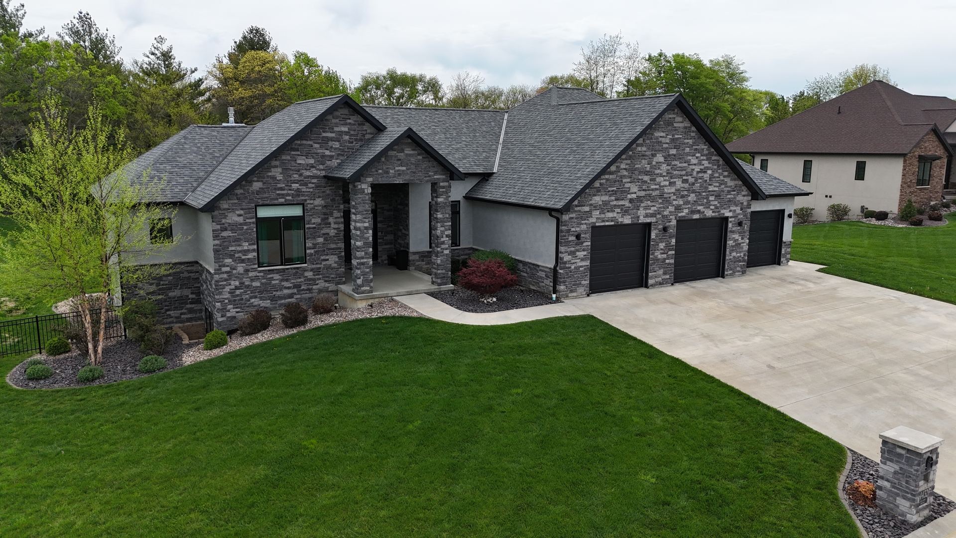 4432 Bryant Drive Quincy, IL 62305 - Photo 1 of 30 a front view of a house with a garden and patio