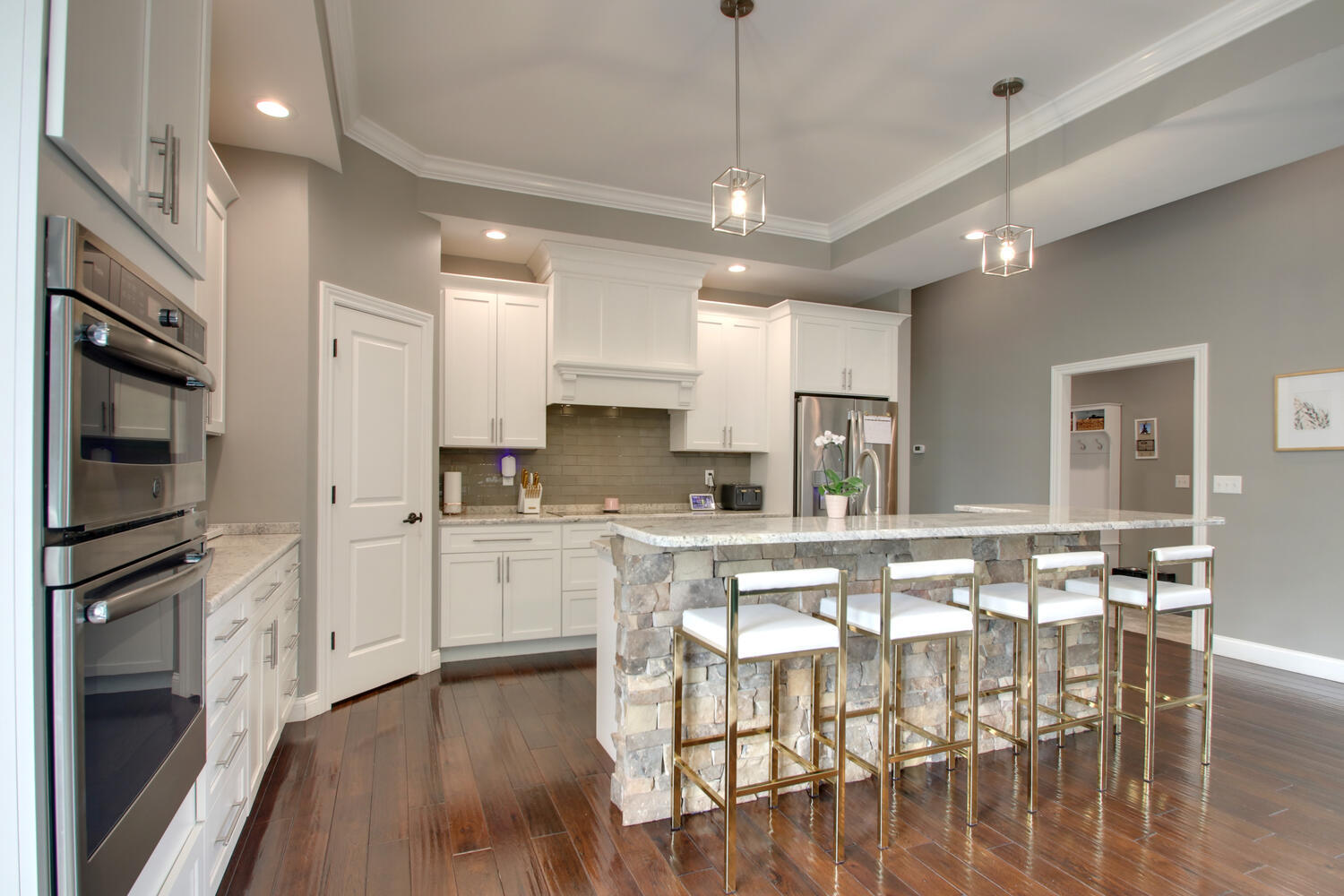 4432 Bryant Drive Quincy, IL 62305 - Photo 15 of 30 an open kitchen with wooden floor and stainless steel appliances