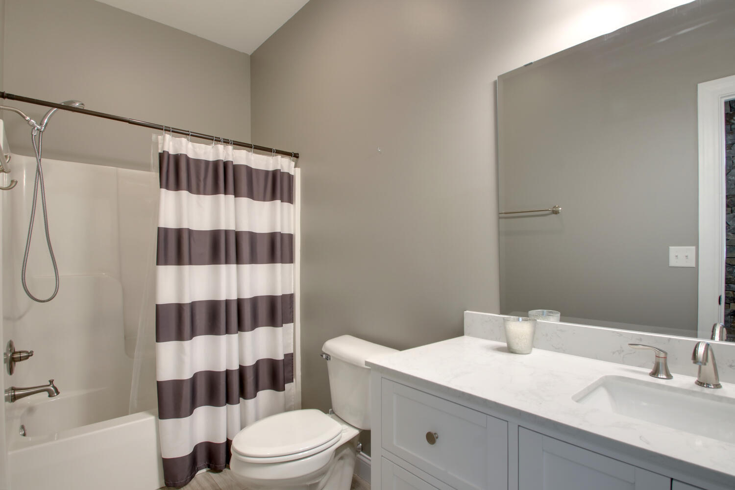 4432 Bryant Drive Quincy, IL 62305 - Photo 29 of 30 a bathroom with a sink a toilet a shower and a mirror