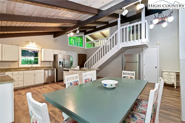 a living room with dining table