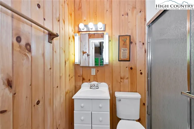 a bathroom with a toilet a sink and shower