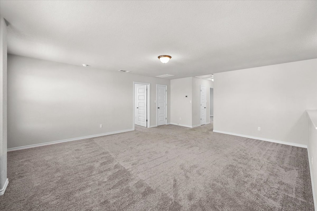 5408 Vanner Path Georgetown, TX 78626 - Photo 15 of 34 Spacious room with gray carpet flooring and white painted walls
