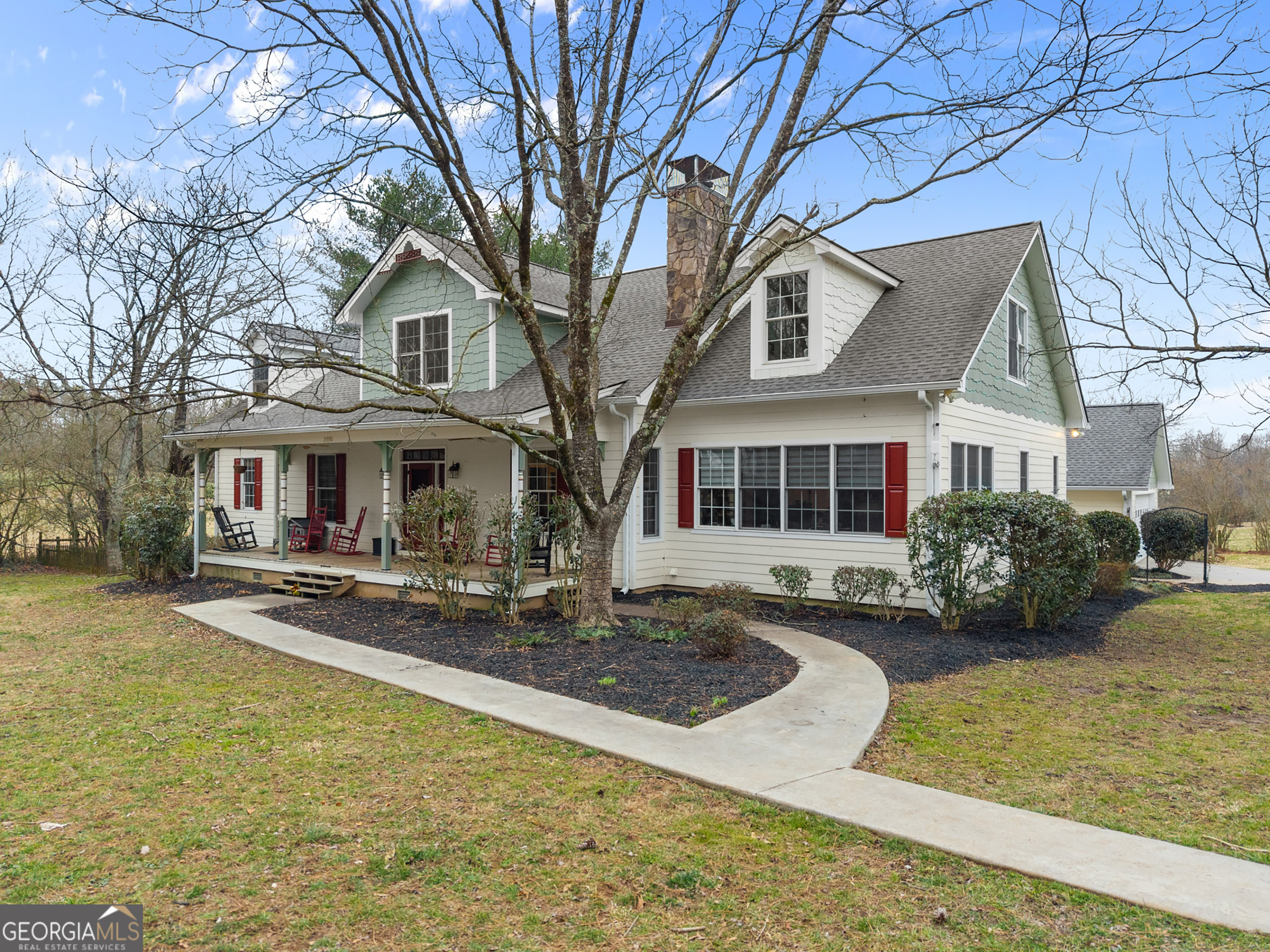1295 Wall Bridge Loop Clarkesville, GA 30523 - Photo 1 of 76 a front view of a house with swimming pool