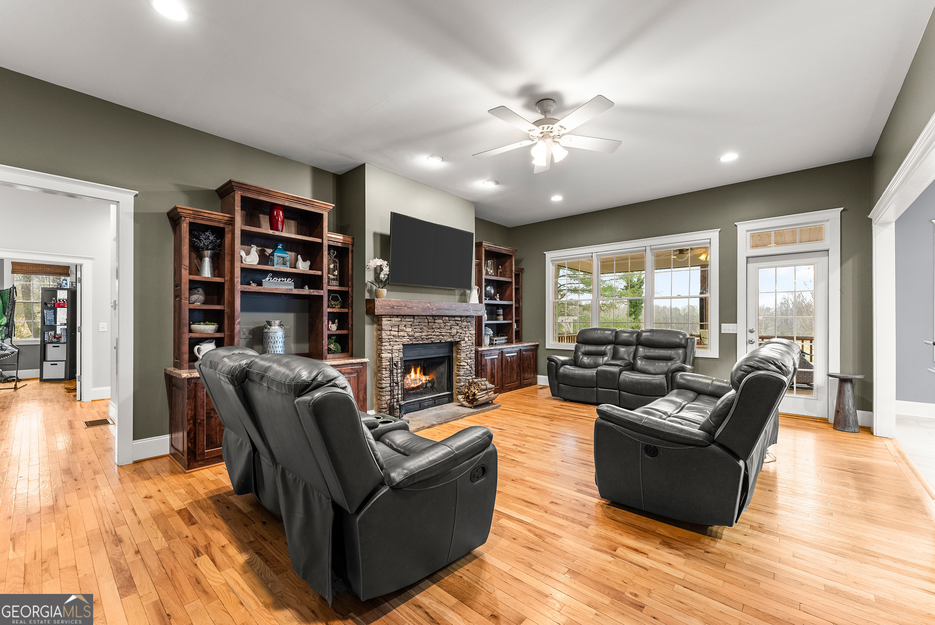 1295 Wall Bridge Loop Clarkesville, GA 30523 - Photo 12 of 76 a living room with furniture and a flat screen tv