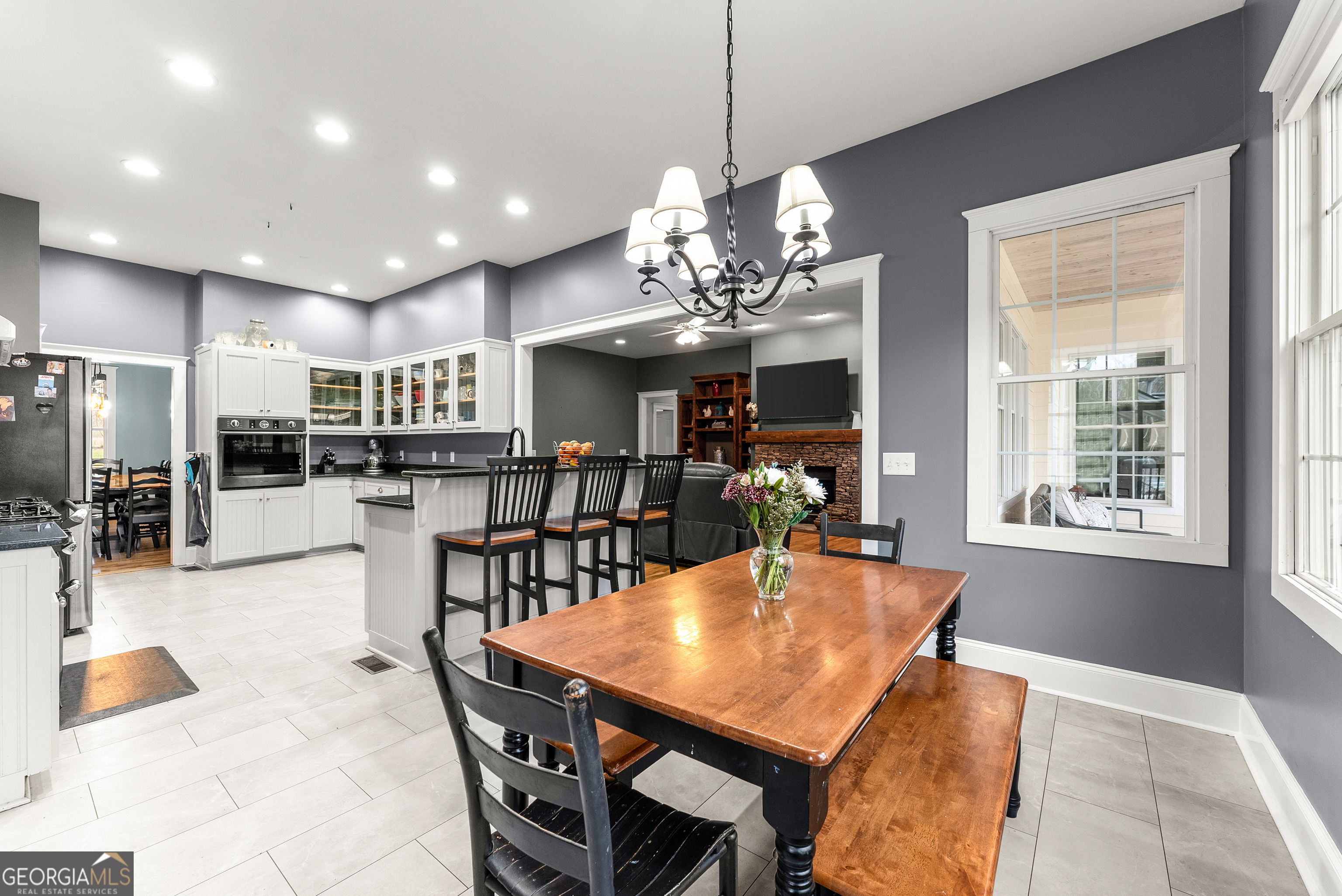 1295 Wall Bridge Loop Clarkesville, GA 30523 - Photo 18 of 76 a view of a dining room and livingroom with furniture wooden floor a chandelier