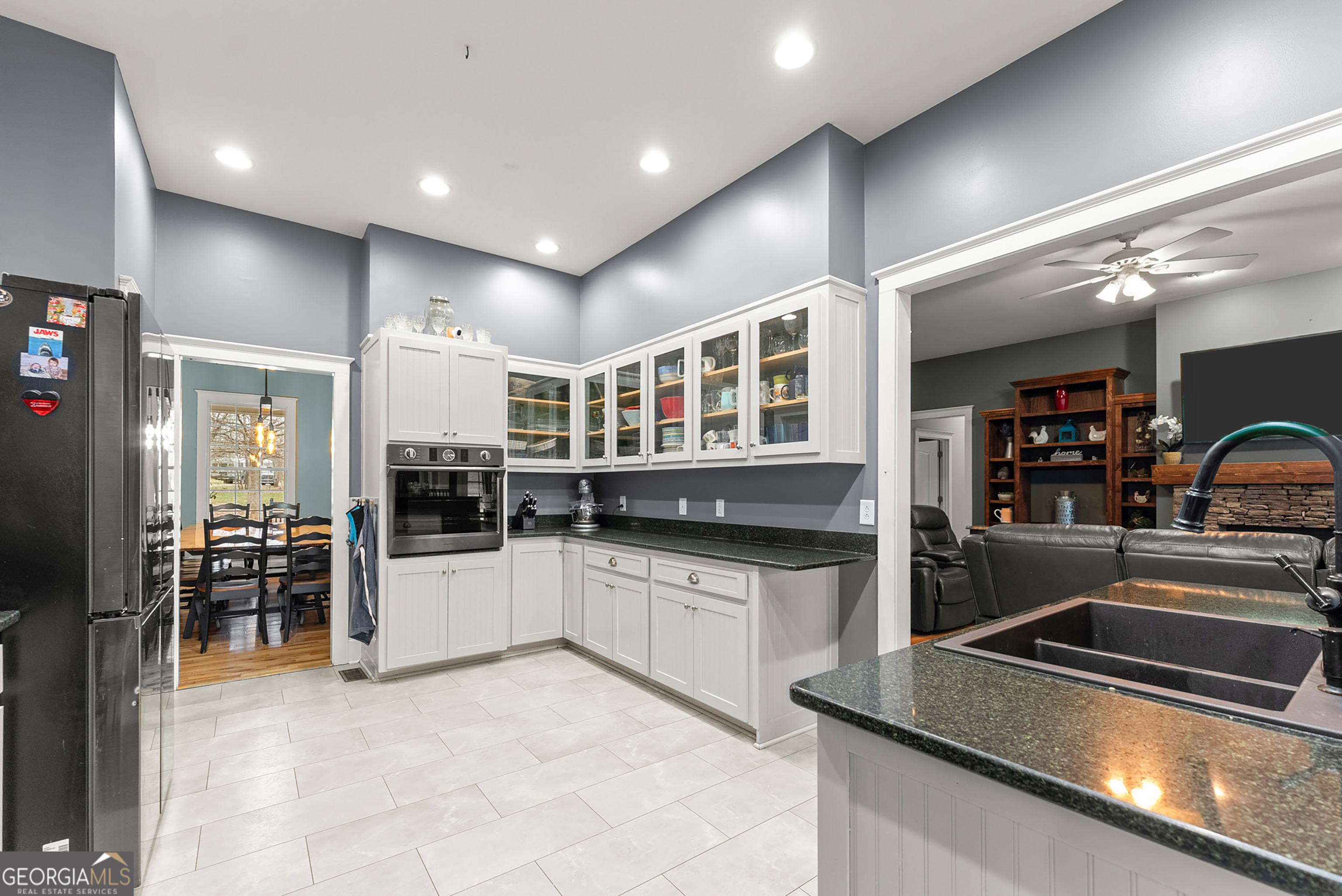 1295 Wall Bridge Loop Clarkesville, GA 30523 - Photo 22 of 76 a kitchen with stainless steel appliances granite countertop a sink and stove