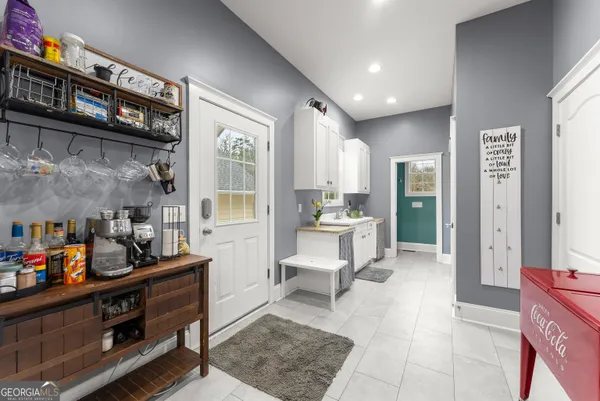 a bathroom with a tub sink and mirror