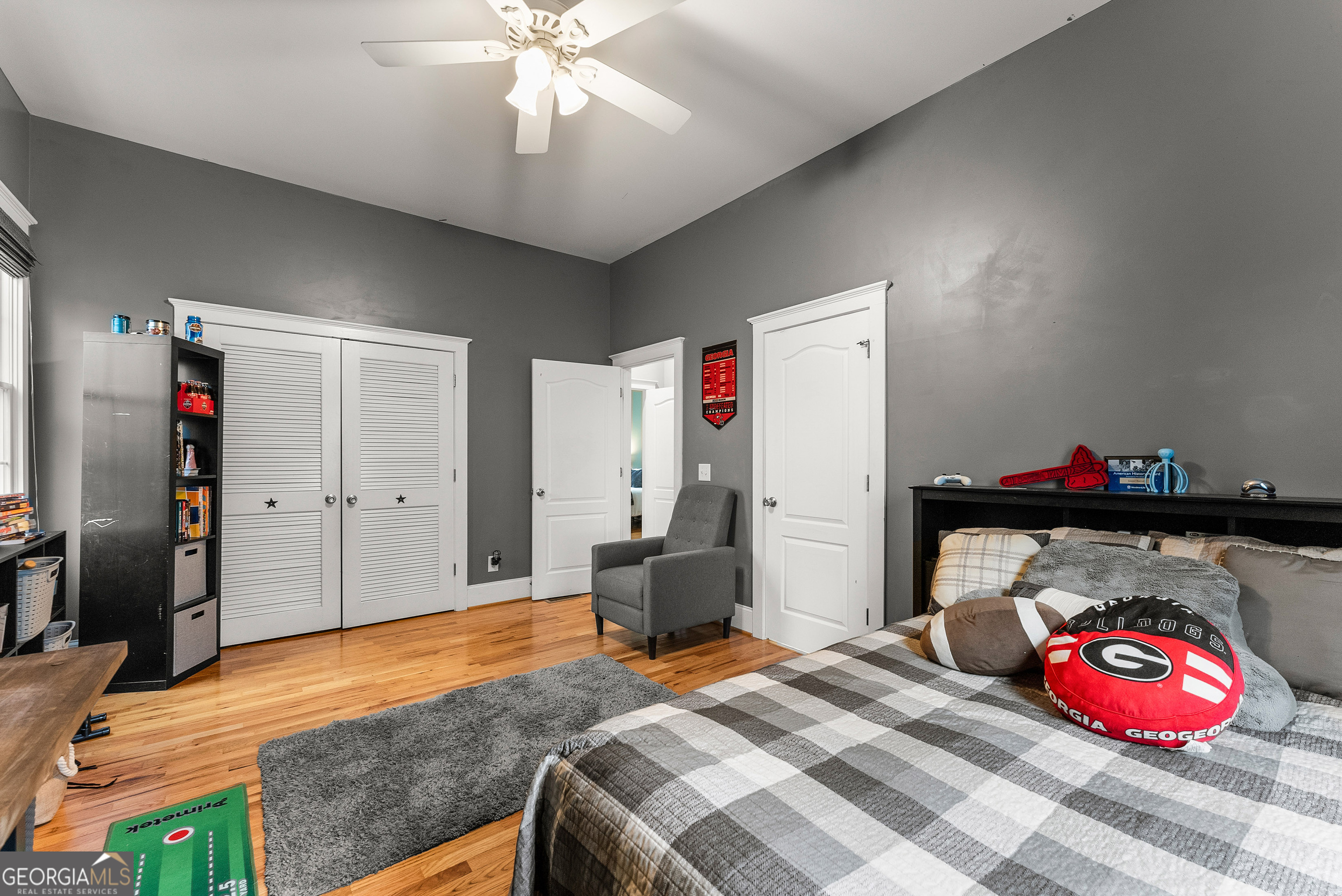 1295 Wall Bridge Loop Clarkesville, GA 30523 - Photo 32 of 76 a bedroom with a bed and a chandelier