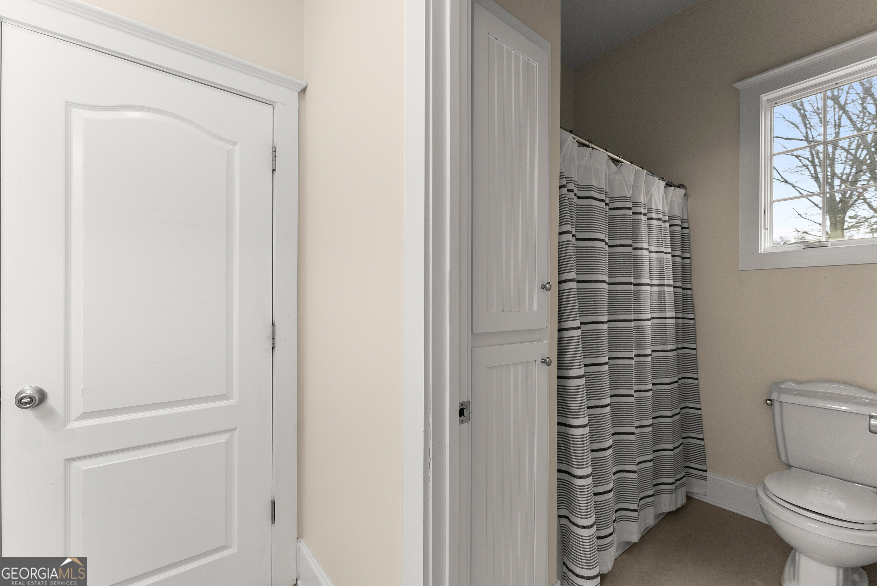 1295 Wall Bridge Loop Clarkesville, GA 30523 - Photo 35 of 76 a bathroom with a toilet and a shower