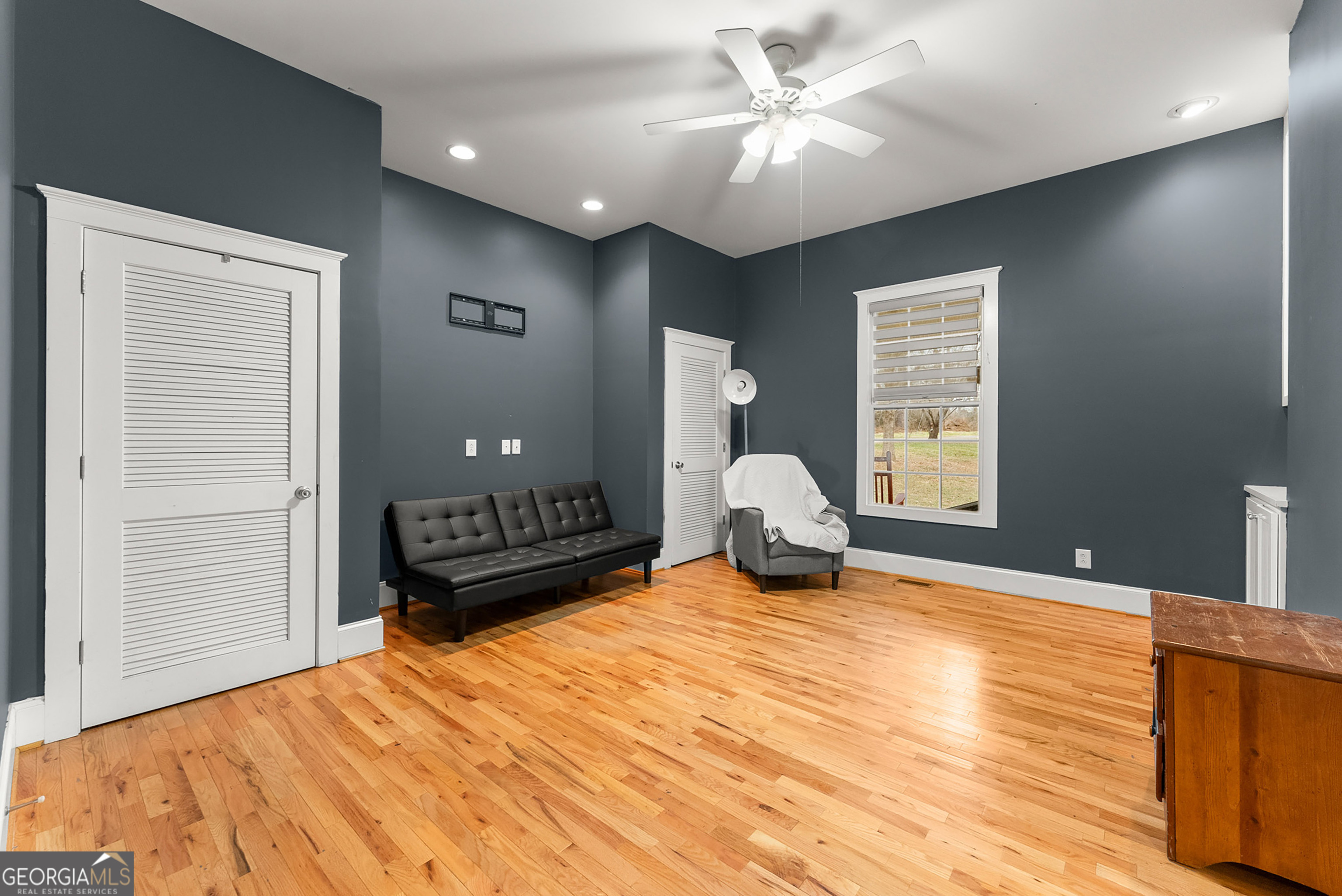 1295 Wall Bridge Loop Clarkesville, GA 30523 - Photo 36 of 76 a bedroom with a bed and a chandelier