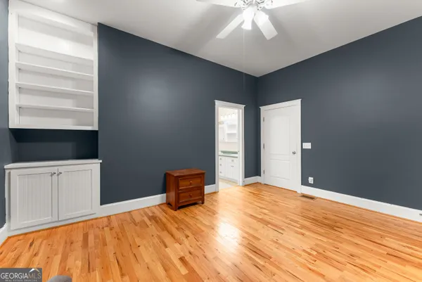 a view of a house with roof deck and sitting area