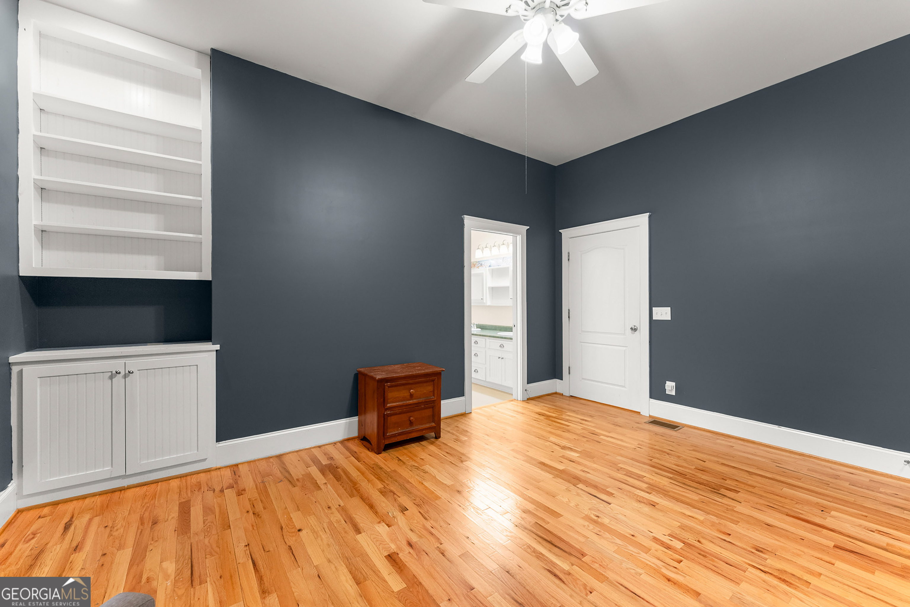1295 Wall Bridge Loop Clarkesville, GA 30523 - Photo 37 of 76 a bedroom with a bed and a chandelier