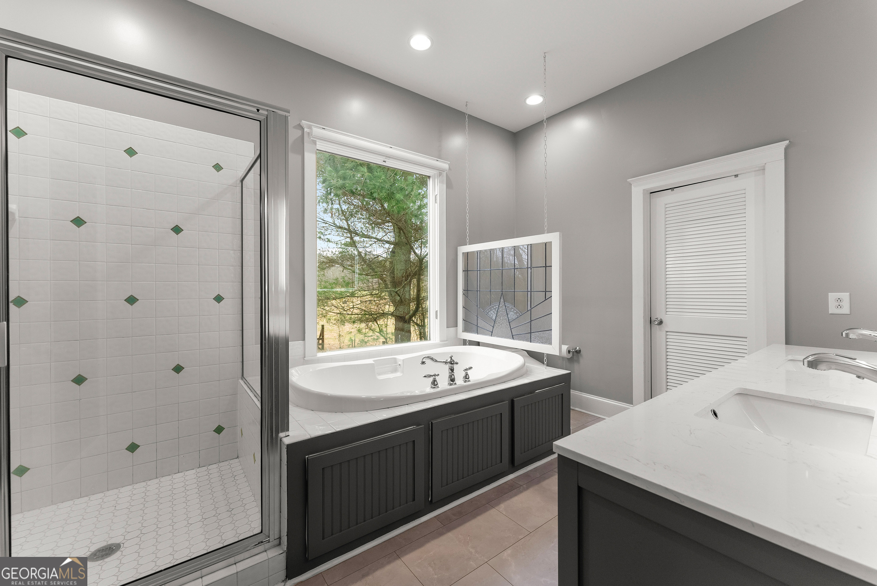 1295 Wall Bridge Loop Clarkesville, GA 30523 - Photo 41 of 76 a spacious bathroom with a shower sink and mirror