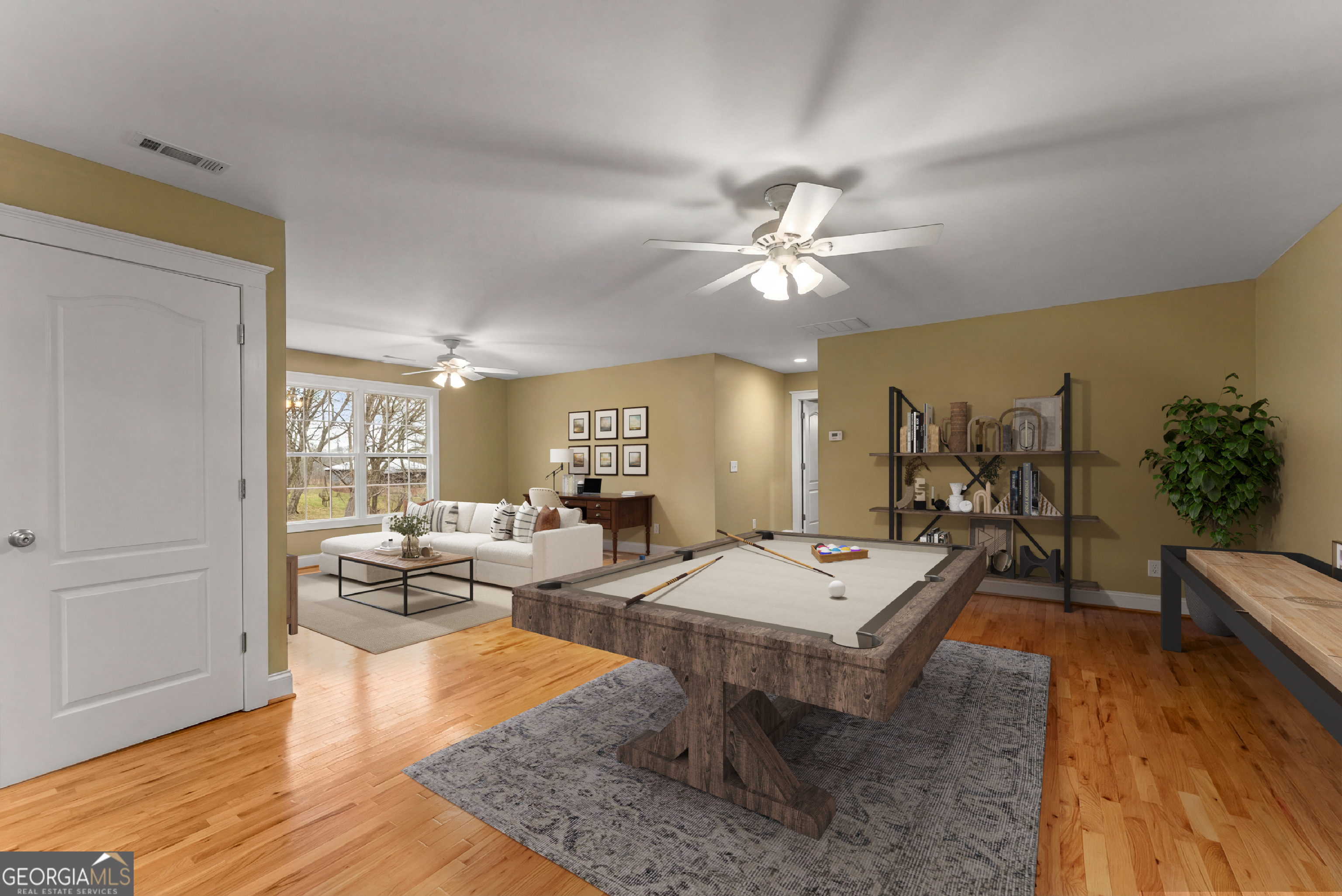 1295 Wall Bridge Loop Clarkesville, GA 30523 - Photo 49 of 76 a living room with patio furniture and a wooden floor