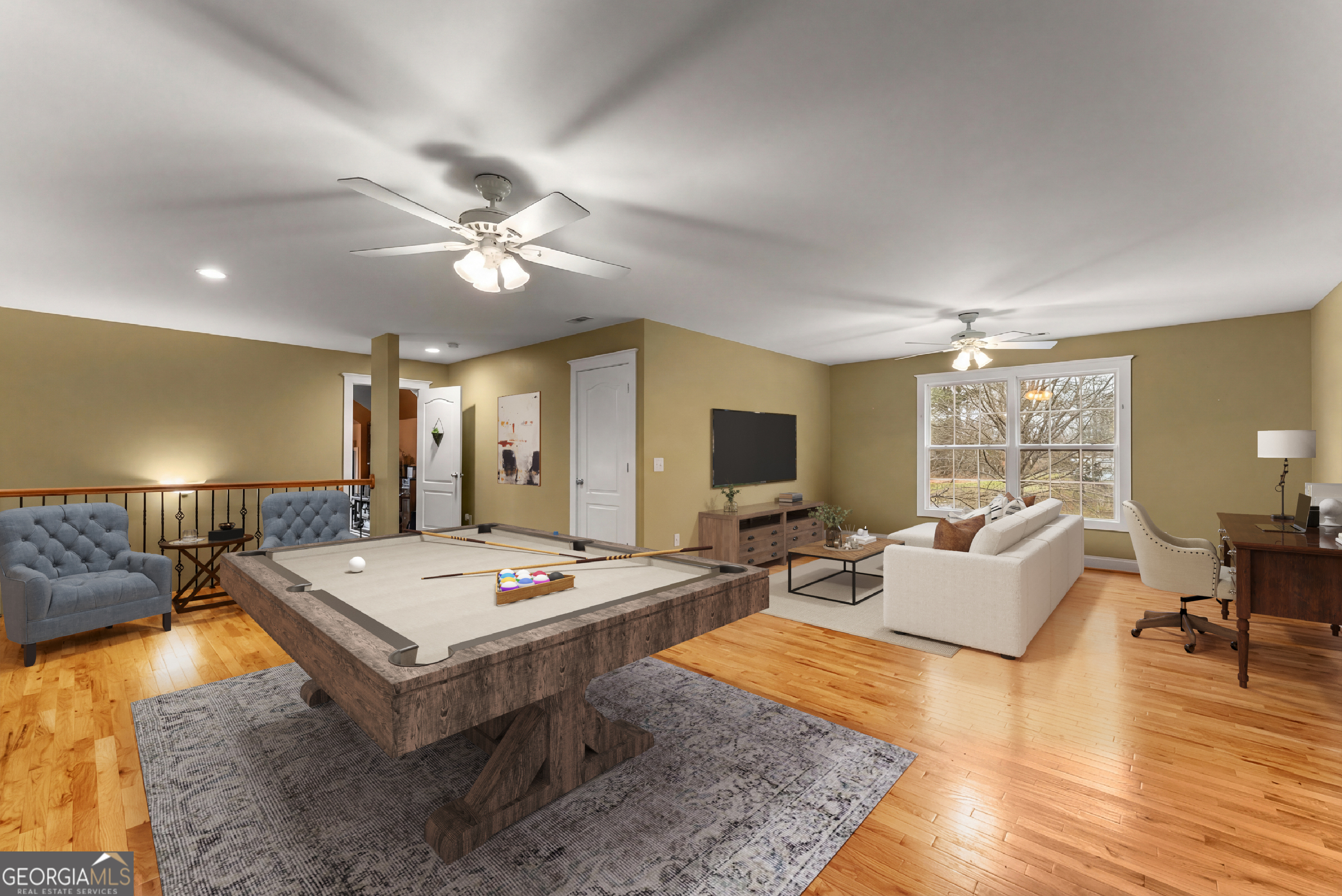 1295 Wall Bridge Loop Clarkesville, GA 30523 - Photo 50 of 76 a living room with furniture a flat screen tv and a table