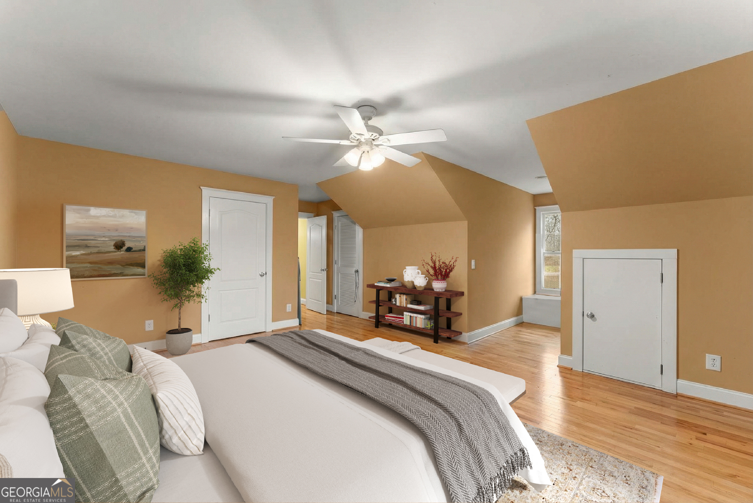 1295 Wall Bridge Loop Clarkesville, GA 30523 - Photo 52 of 76 a bedroom with a bed and ceiling fan