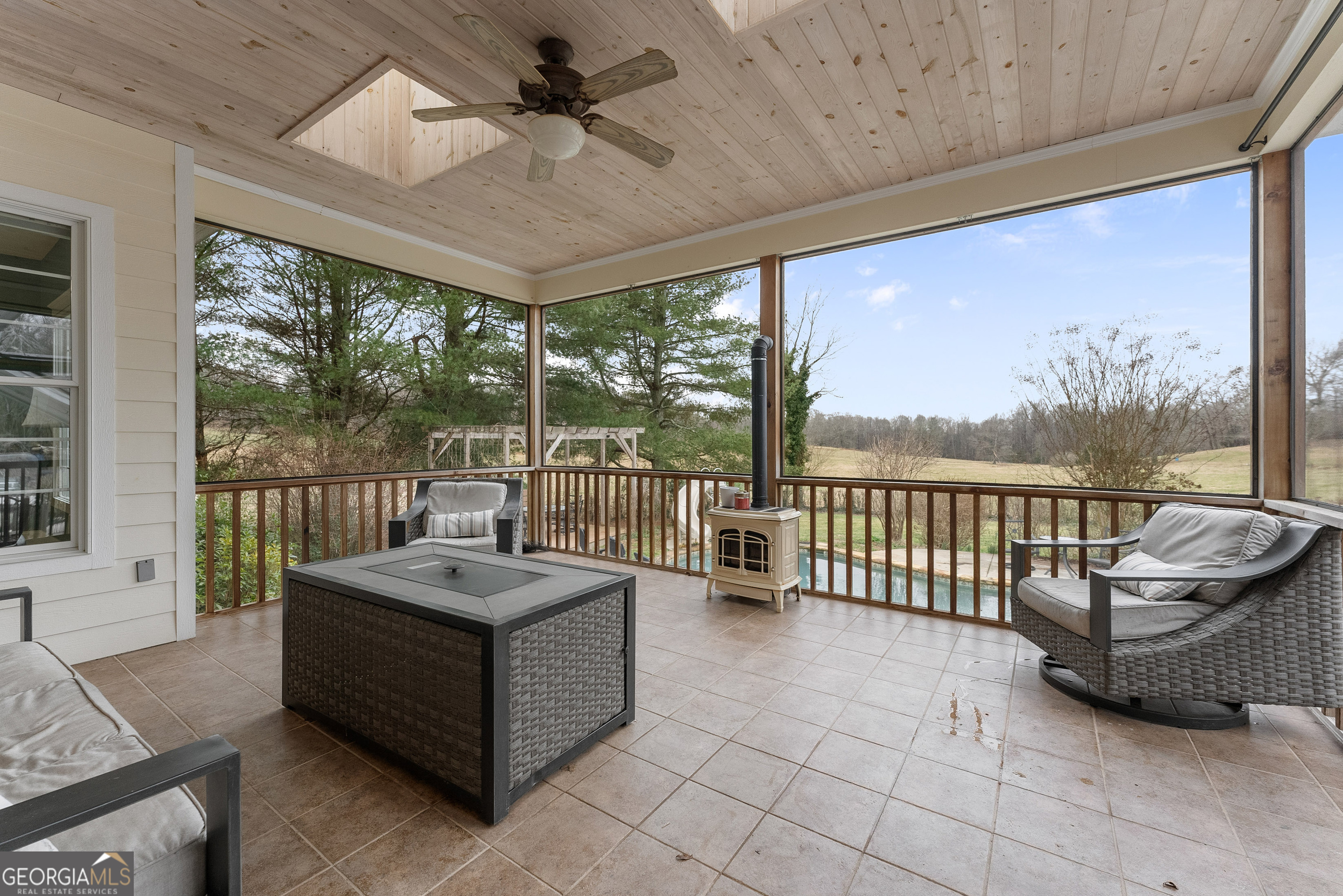 1295 Wall Bridge Loop Clarkesville, GA 30523 - Photo 53 of 76 a living room with furniture and a floor to ceiling window
