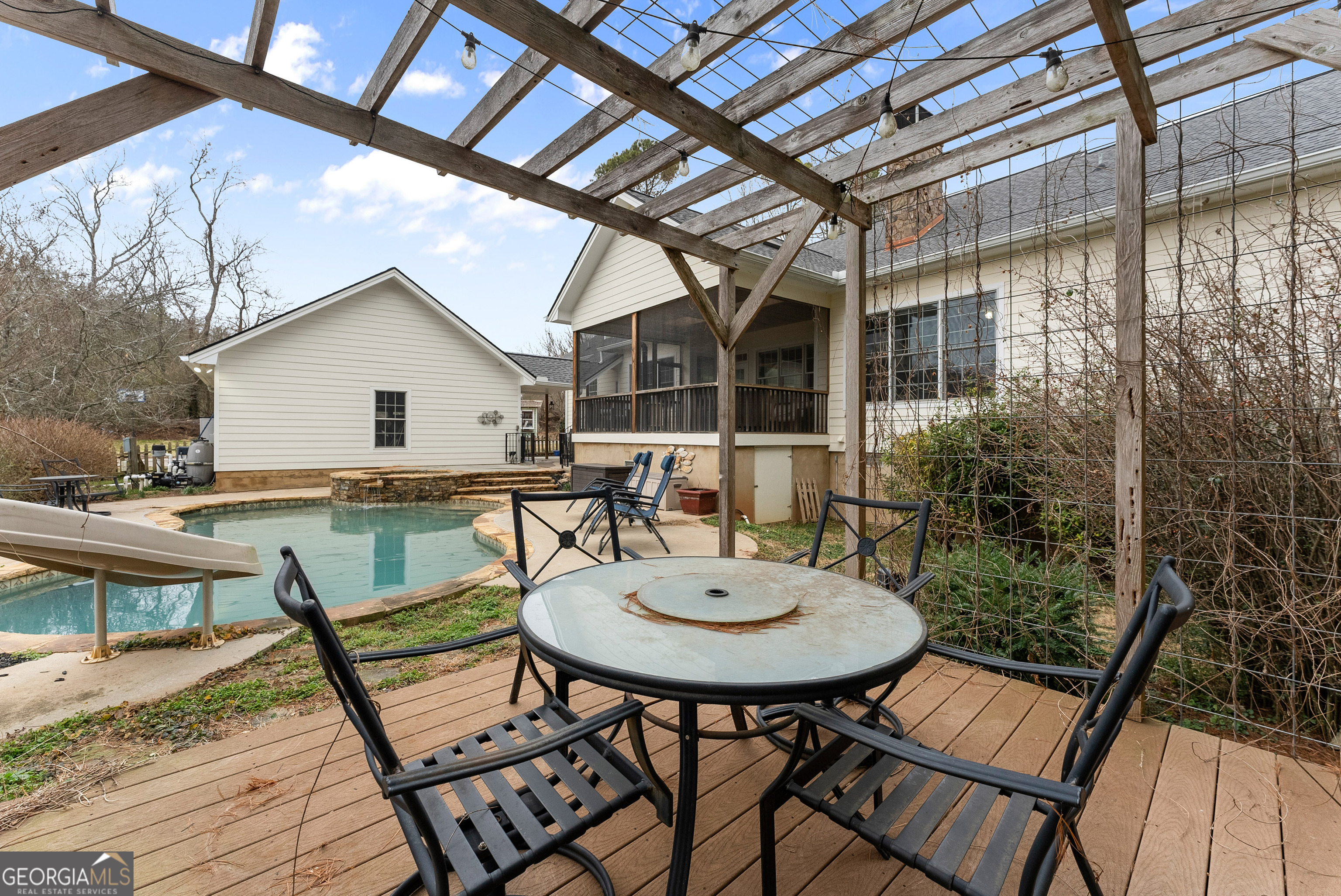 1295 Wall Bridge Loop Clarkesville, GA 30523 - Photo 59 of 76 a view of a patio with table and chairs and wooden floor