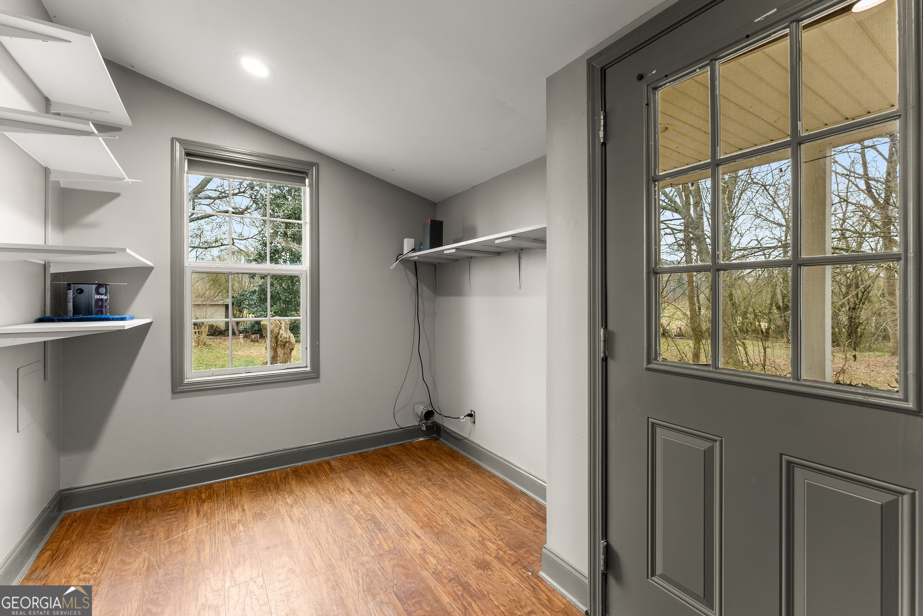 1295 Wall Bridge Loop Clarkesville, GA 30523 - Photo 66 of 76 a view of an empty room with a window and wooden floor