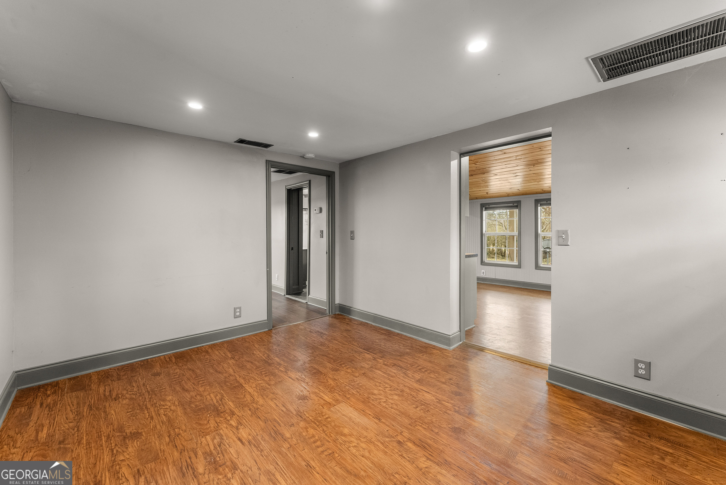1295 Wall Bridge Loop Clarkesville, GA 30523 - Photo 68 of 76 a view of an empty room with wooden floor and a window