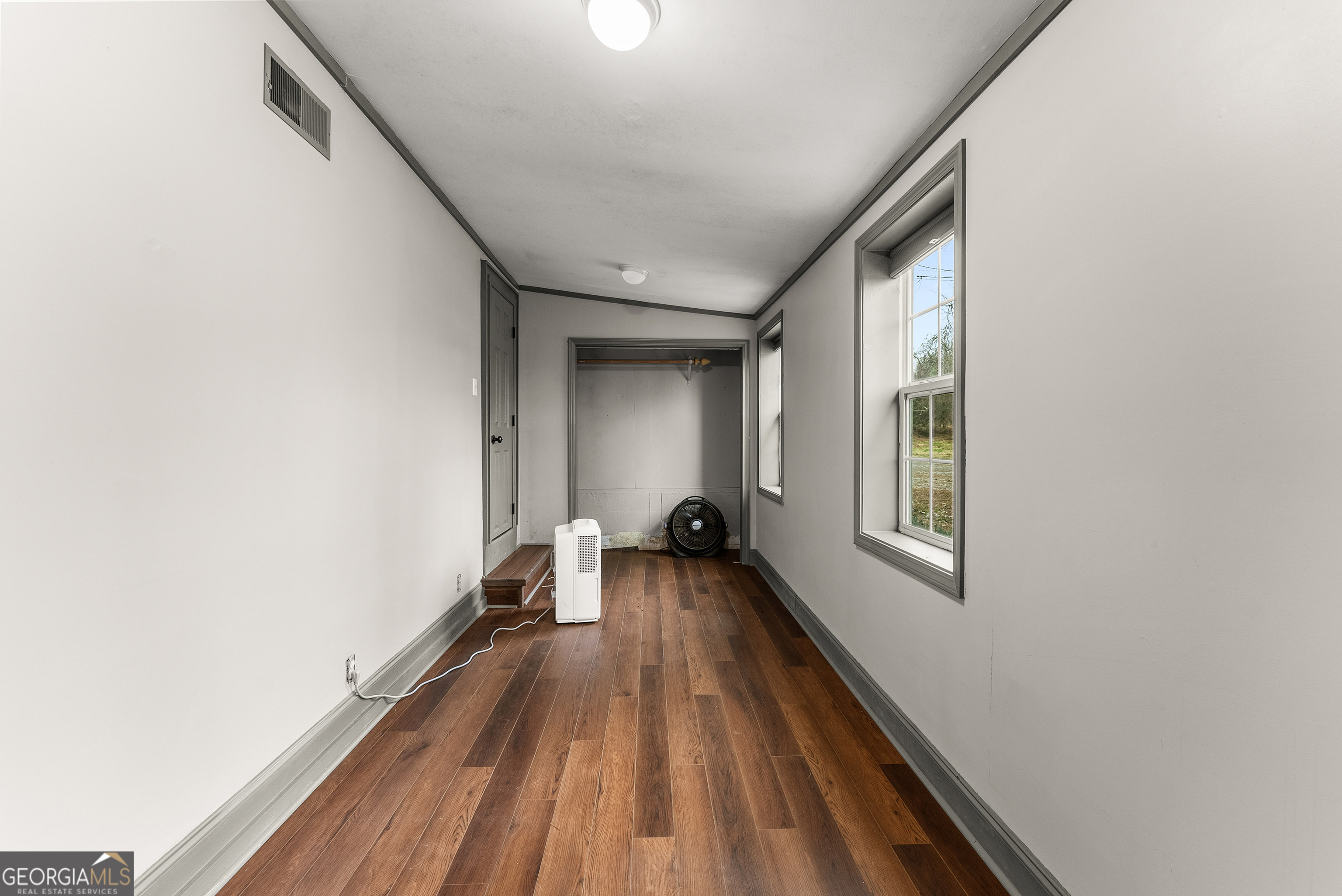 1295 Wall Bridge Loop Clarkesville, GA 30523 - Photo 72 of 76 a view of a room with wooden floor and a window