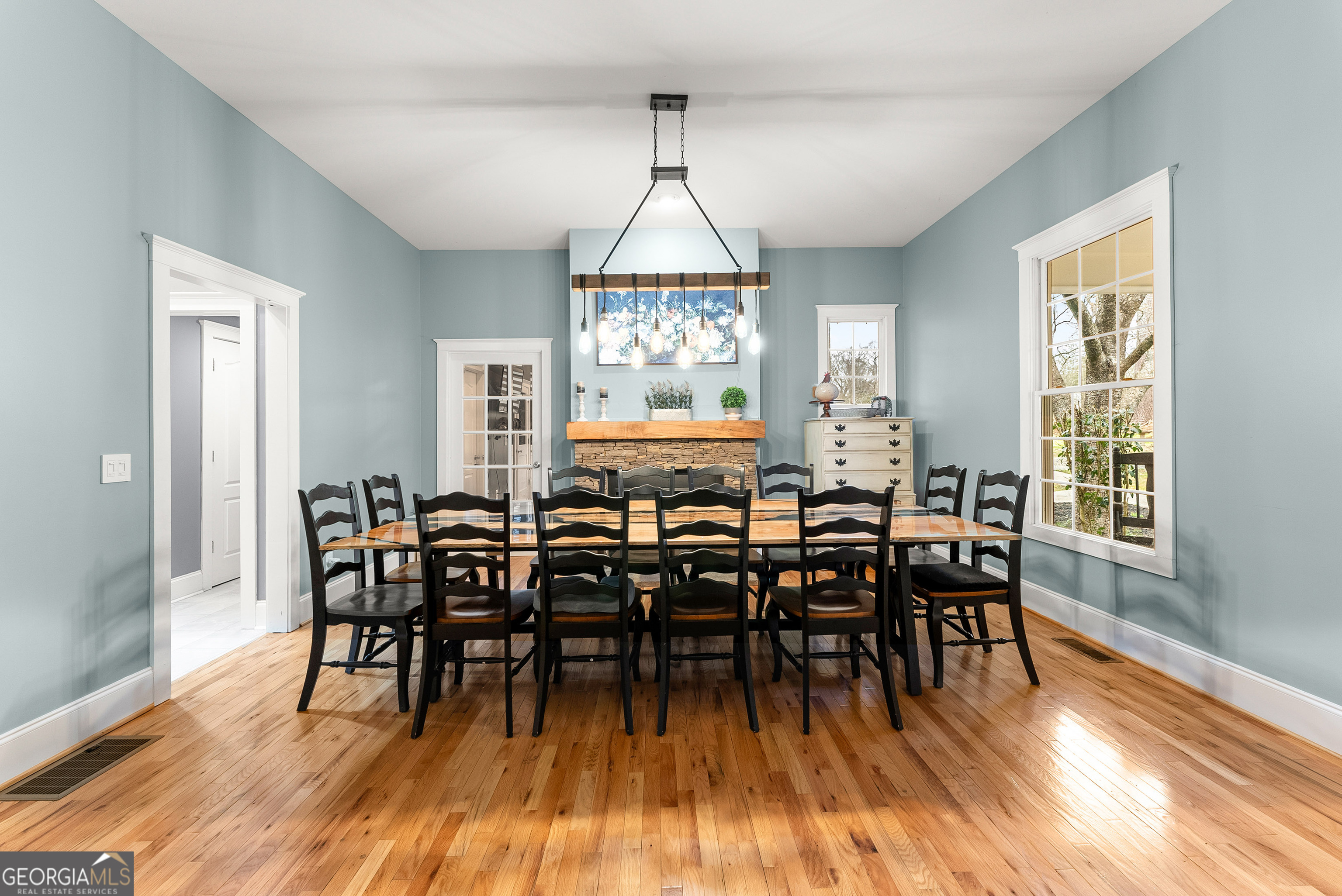 1295 Wall Bridge Loop Clarkesville, GA 30523 - Photo 10 of 76 a view of a a dining room with furniture window and wooden floor