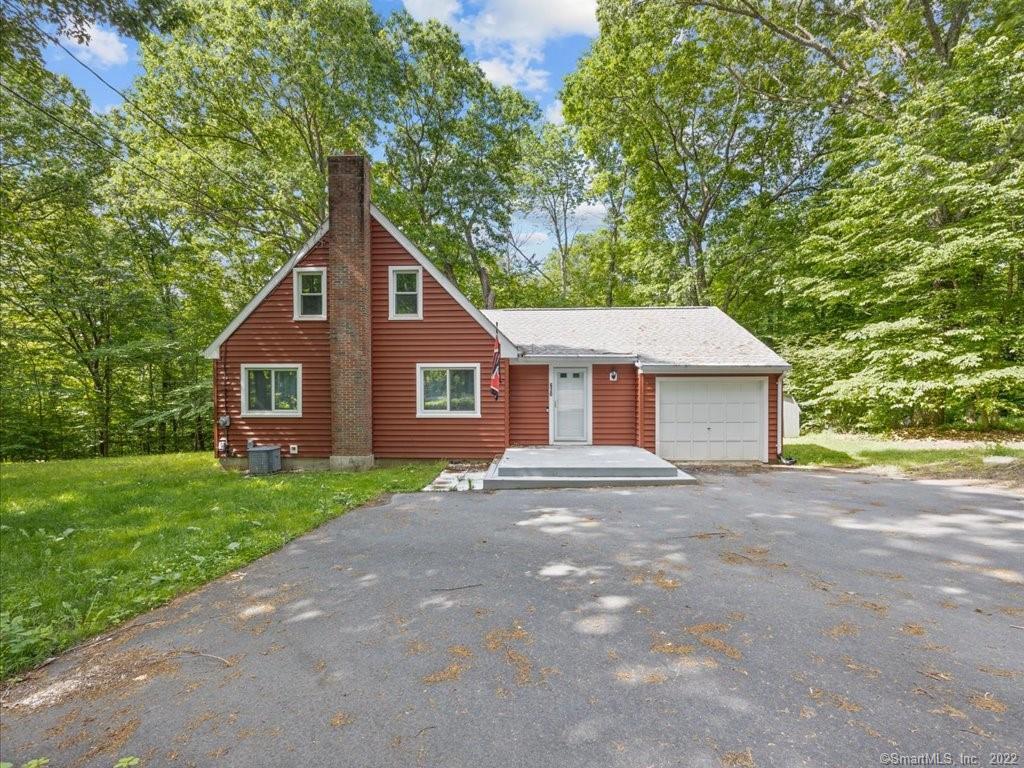 630 Merrow Road Tolland, CT 06084 - Photo 1 of 1 a view of a yard in front of a house with large trees