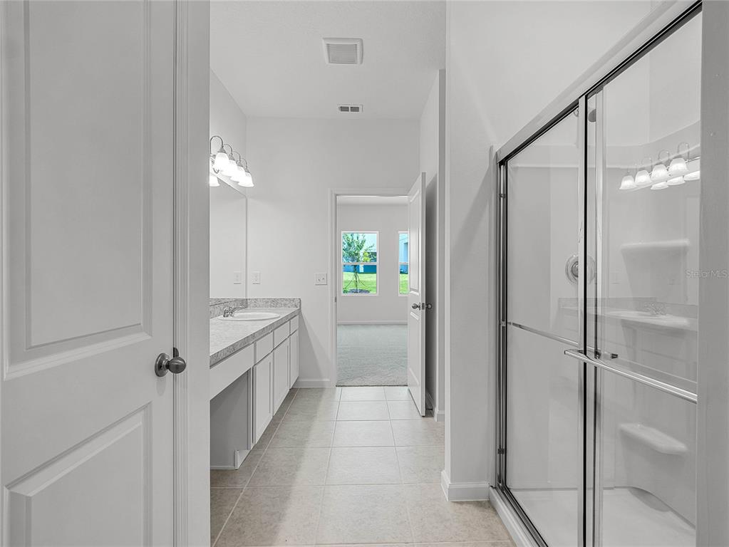 2202 Raven Rdg Road Clermont, FL 34715 - Photo 20 of 37 a bathroom with a shower and a sink