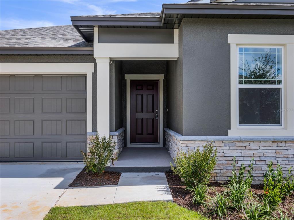 2202 Raven Rdg Road Clermont, FL 34715 - Photo 2 of 37 a front view of a house with plants