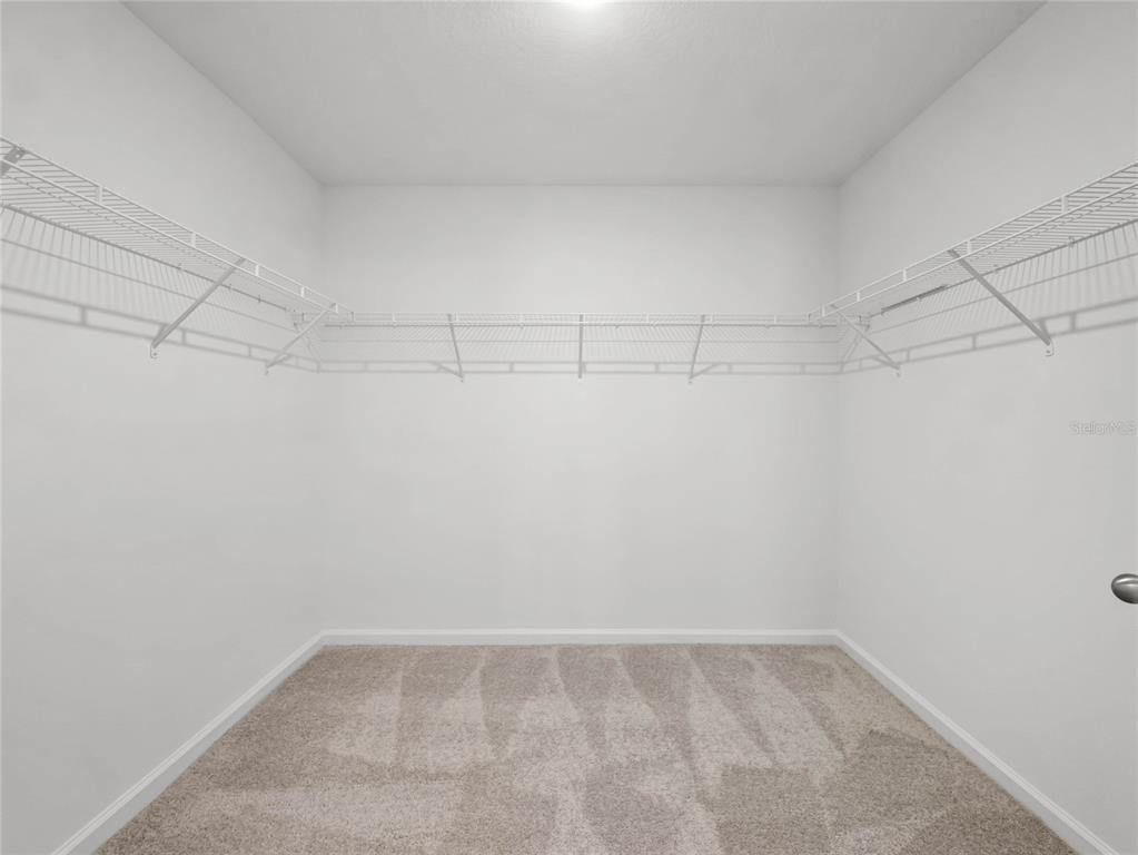2202 Raven Rdg Road Clermont, FL 34715 - Photo 21 of 37 a view of a room with racks on the wall