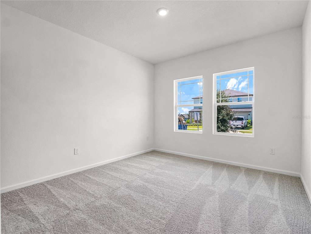 2202 Raven Rdg Road Clermont, FL 34715 - Photo 24 of 37 an empty room with windows