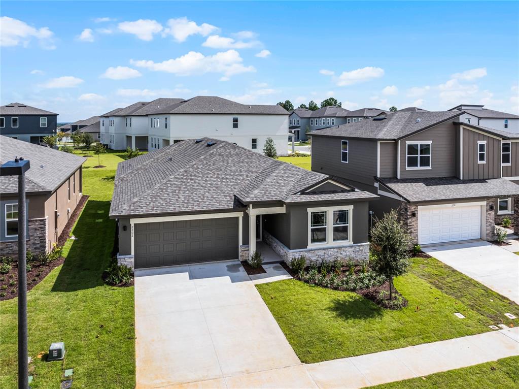 2202 Raven Rdg Road Clermont, FL 34715 - Photo 27 of 37 a front view of a house with a yard