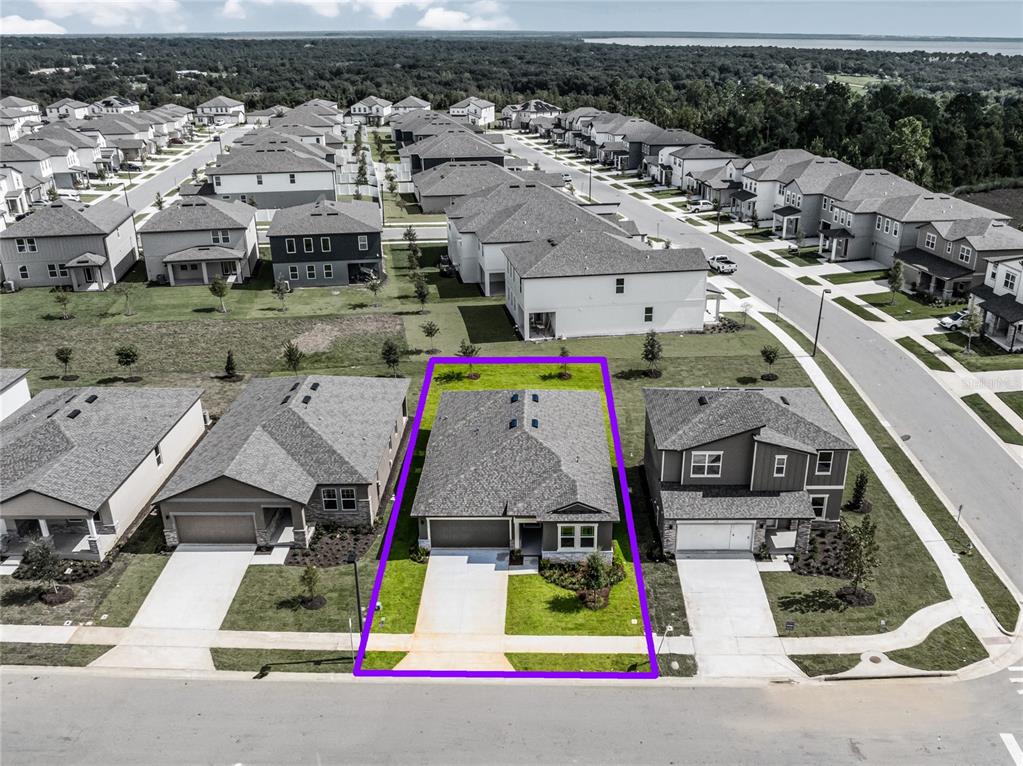 2202 Raven Rdg Road Clermont, FL 34715 - Photo 3 of 37 an aerial view of residential houses with outdoor space