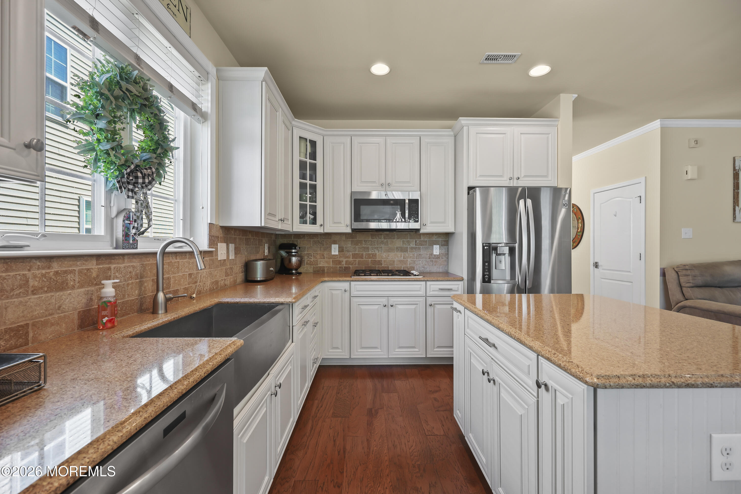 51 Mason Drive Jackson, NJ 08527 - Photo 15 of 39 a kitchen with stainless steel appliances granite countertop a sink refrigerator and microwave