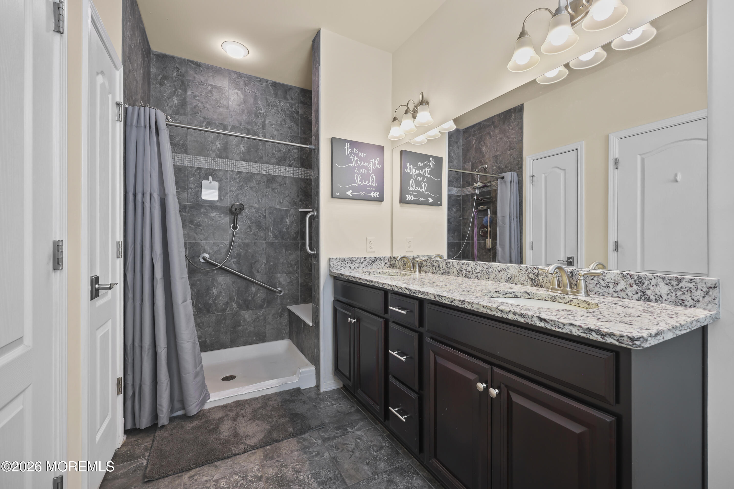 51 Mason Drive Jackson, NJ 08527 - Photo 19 of 39 a bathroom with a granite countertop sink a mirror and a shower